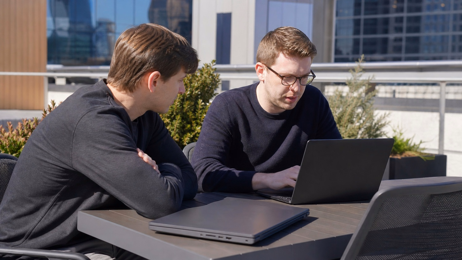 OUTDOOR TERRACE An IT professional  one or two people working at a table on a