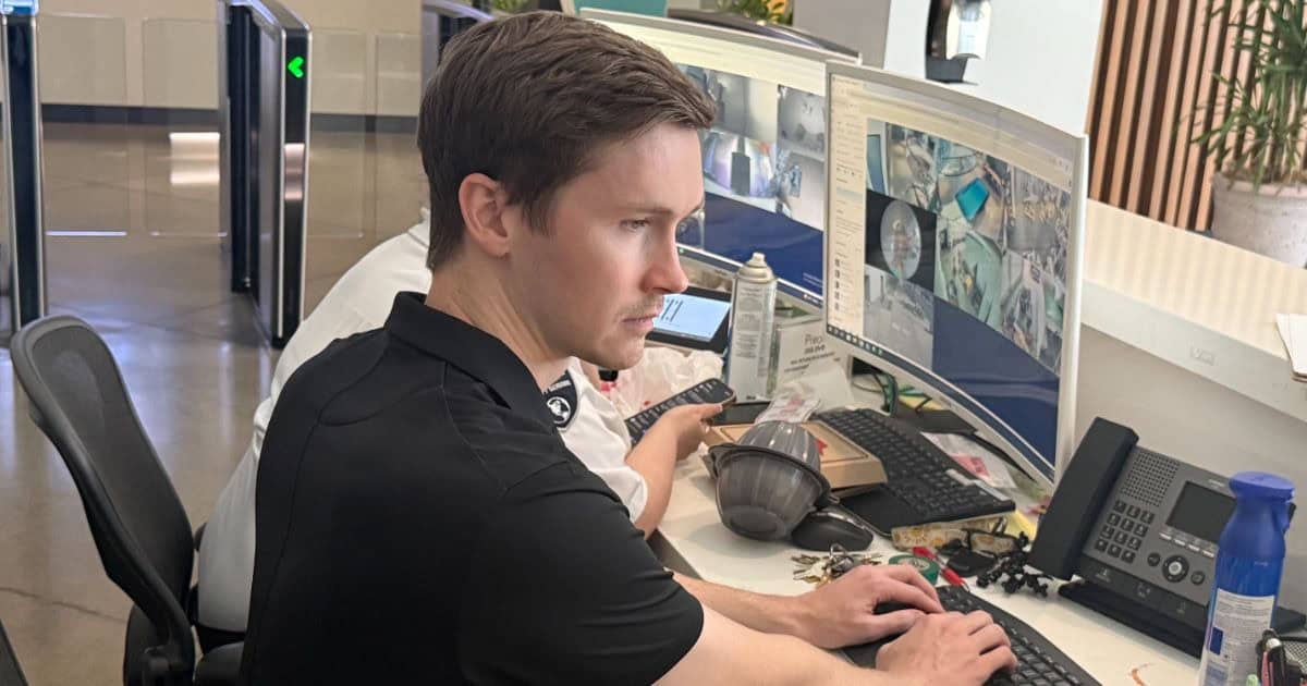 MBPS security analyst monitoring live system activity on multiple displays
