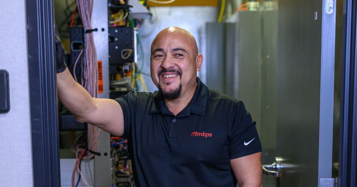 MBPS technician servicing network cabling on site