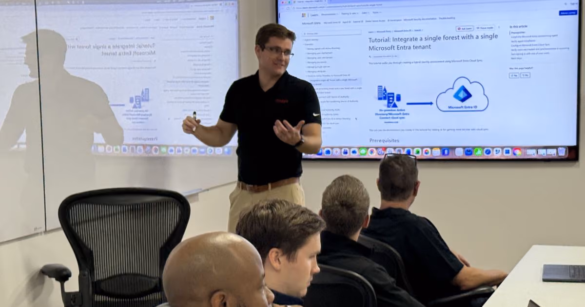 MBPS presenter explaining a cloud services diagram to seated staff