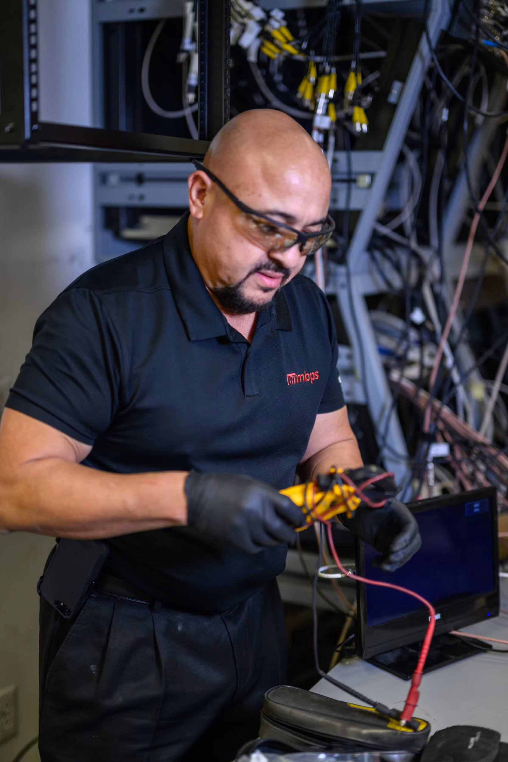 MBPS engineer working on network hardware