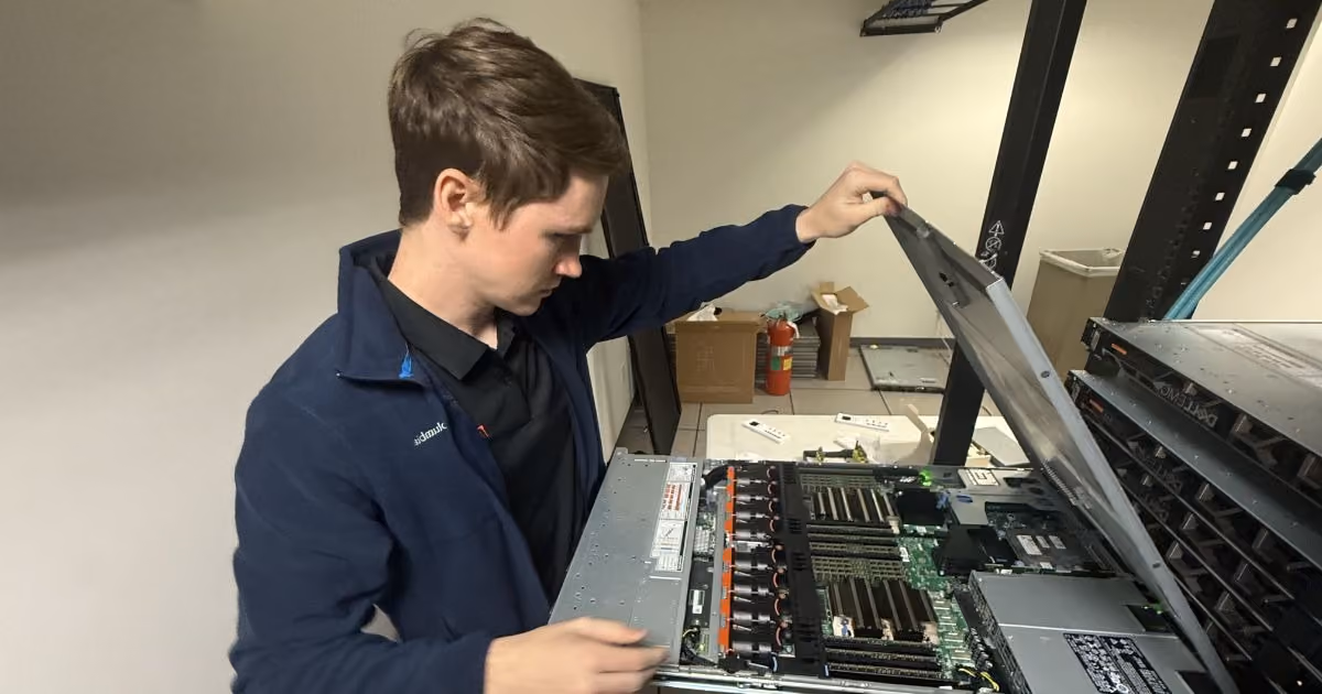 MBPS engineer opening a rack-mounted server to inspect the hardware